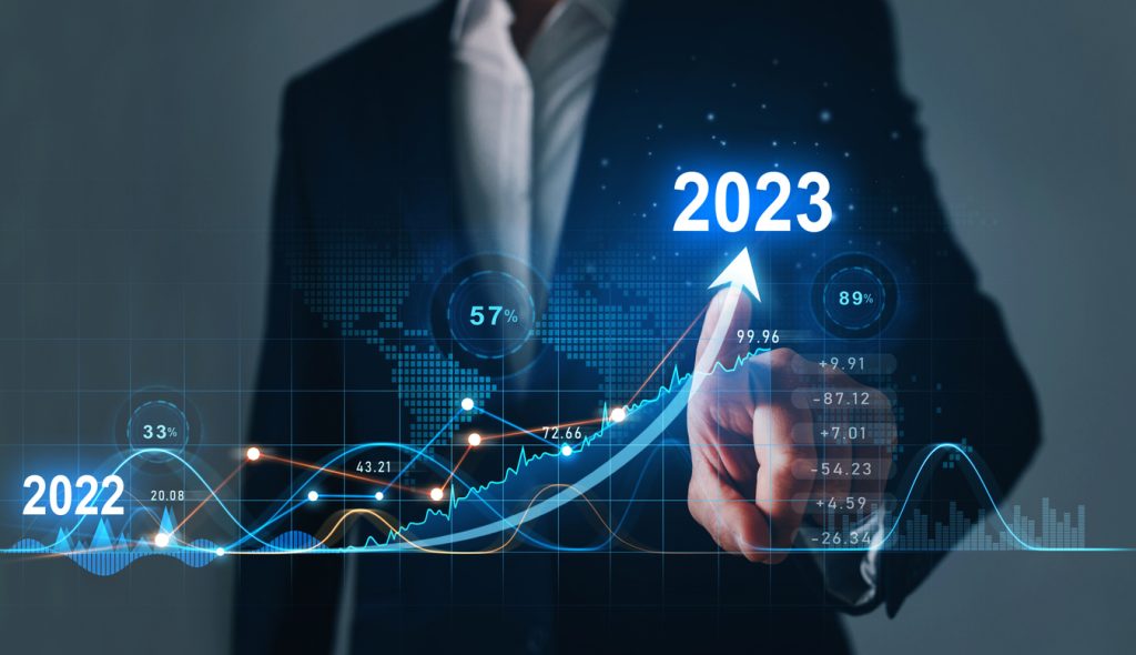 Businessman draws increase arrow graph corporate future growth year 2022 to 2023. Planning,opportunity, challenge and business strategy. New Goals, Plans and Visions for Next Year 2023